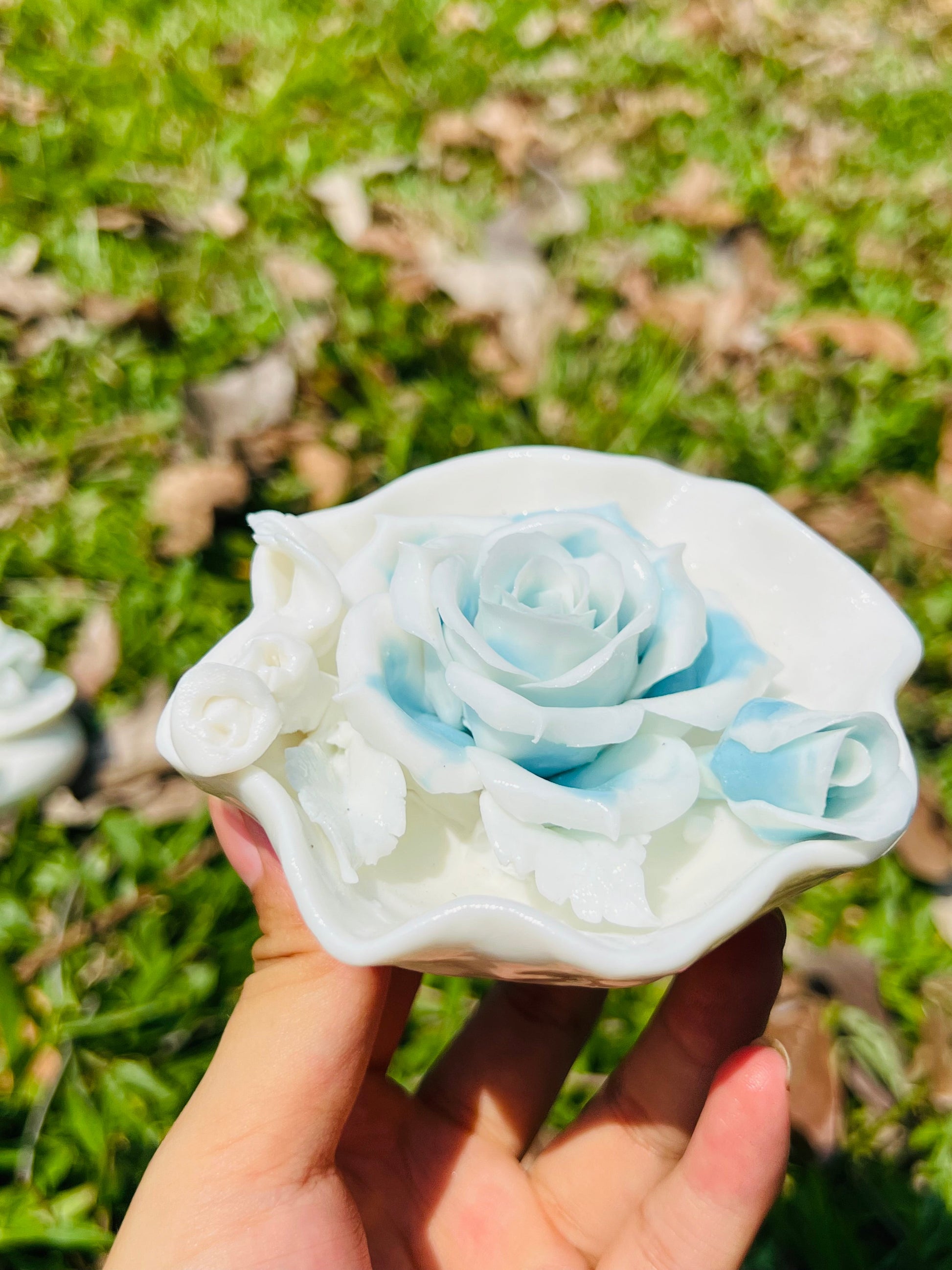 this is a woodfired white fine pottery flower teacup