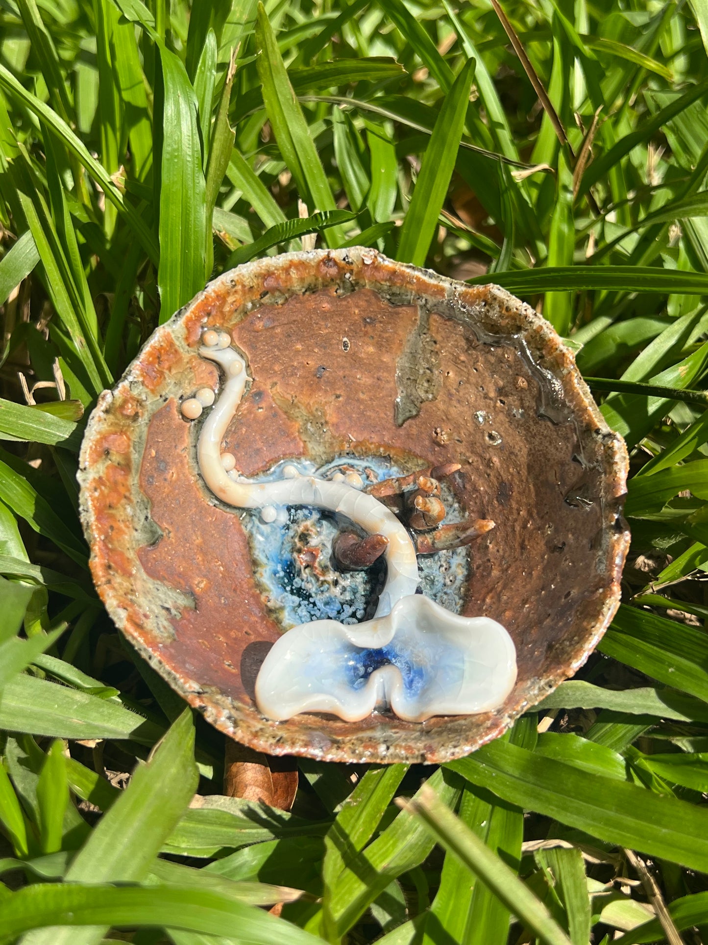 This is a woodfired pottery flower teacup