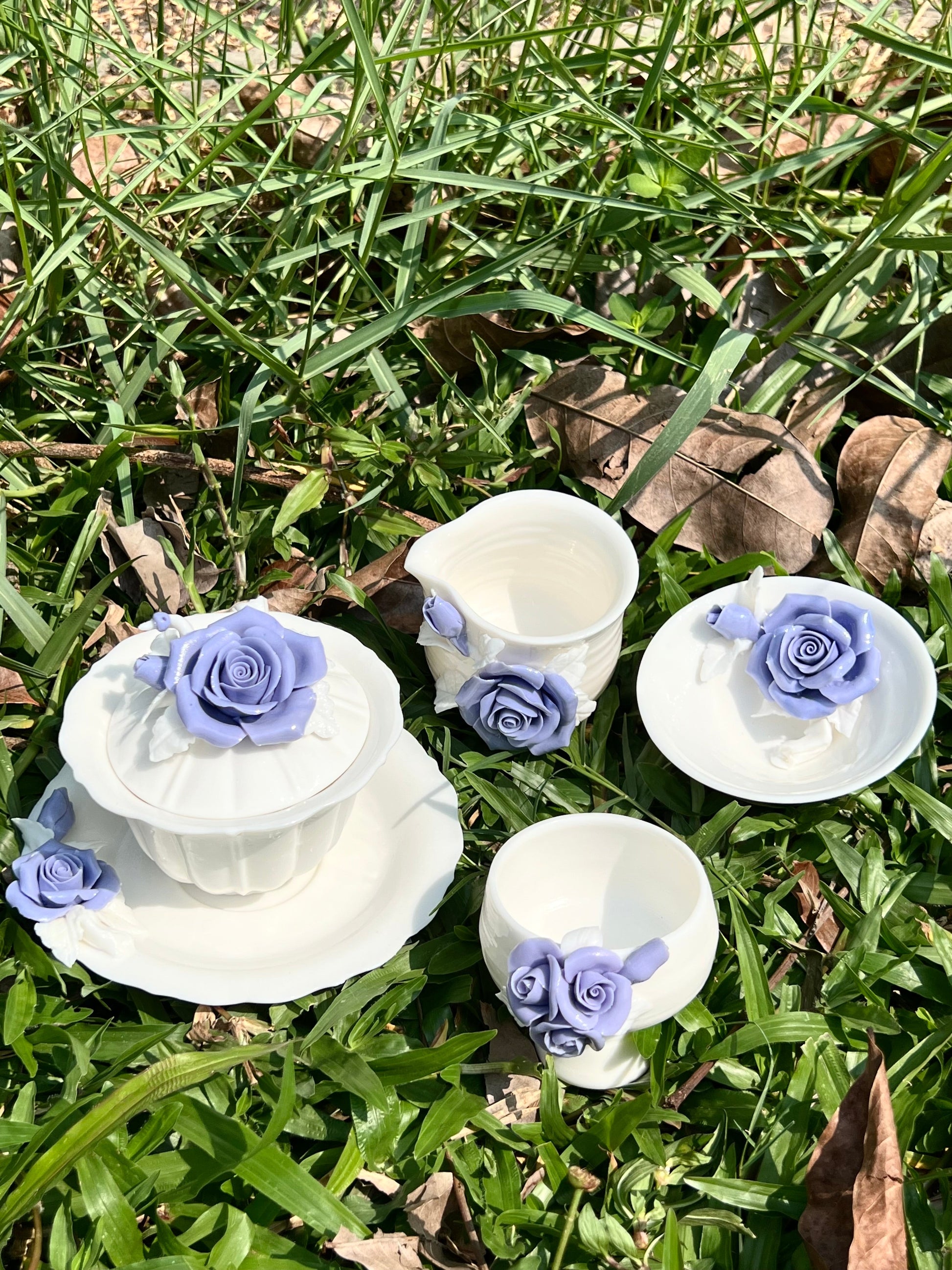 this is a woodfired white fine pottery flower teacup