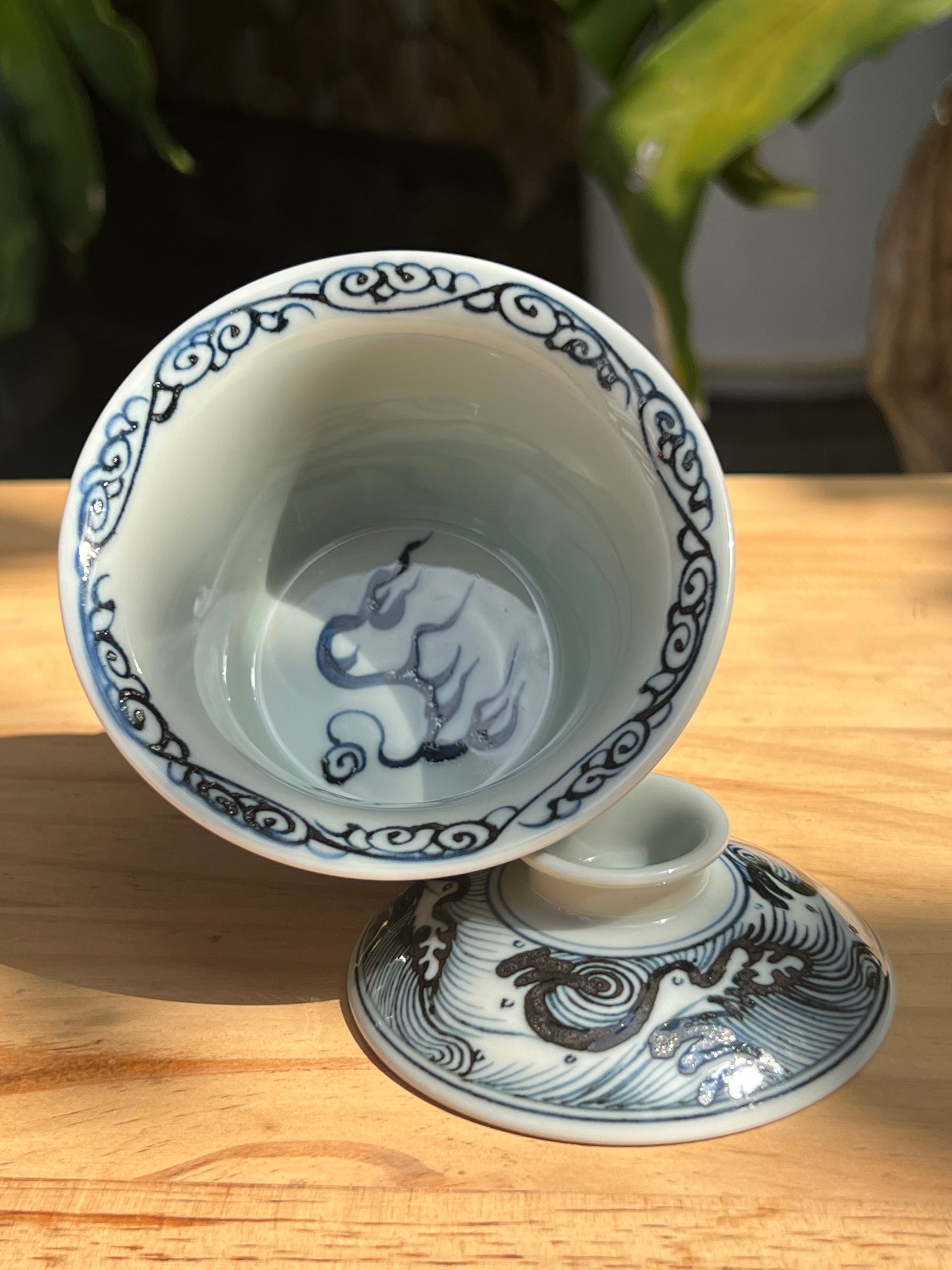 This is a Chinese Jingdezhen blue and white porcelain dragon teapot gaiwan