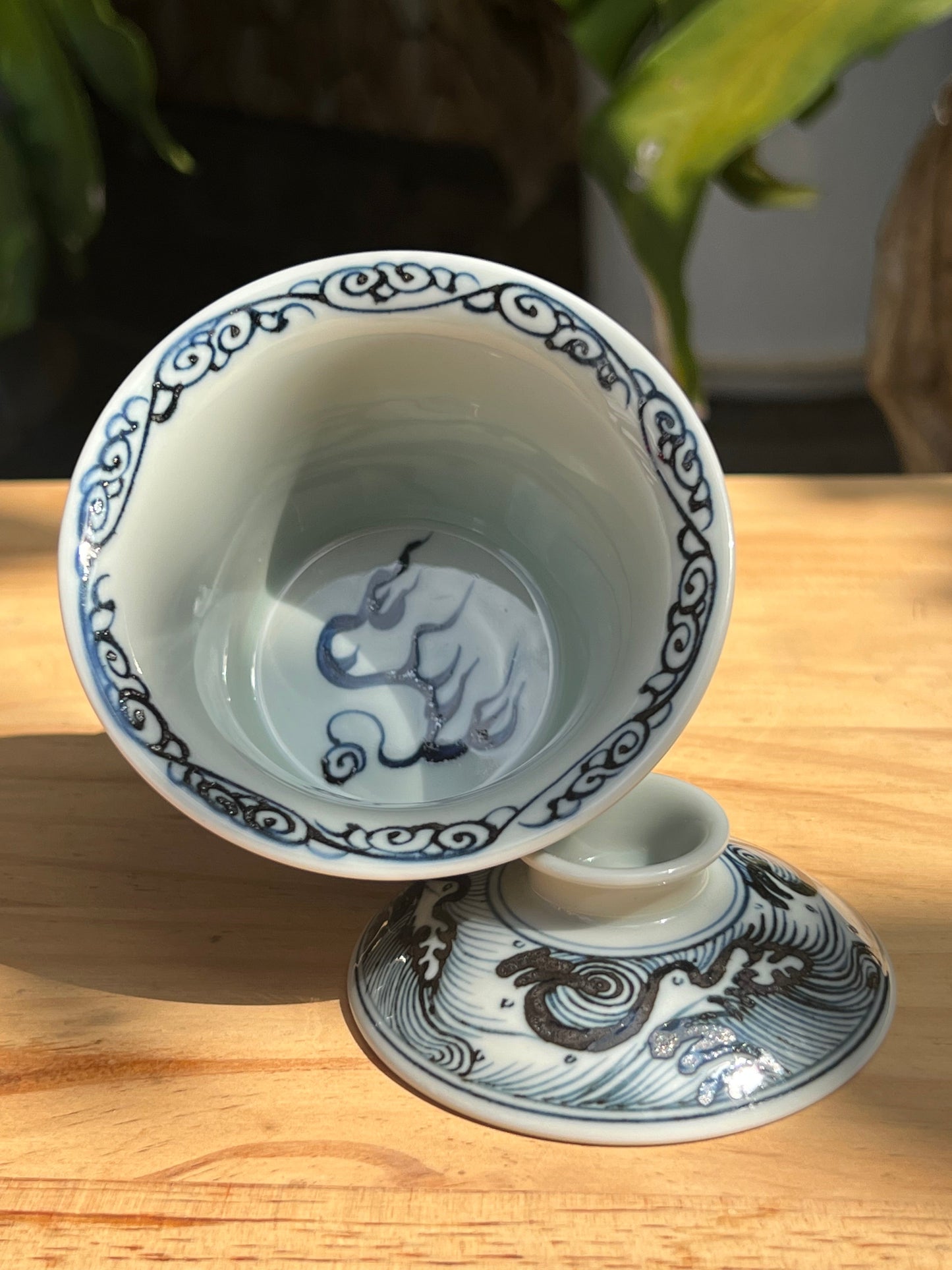 This is a Chinese Jingdezhen blue and white porcelain dragon tea cup