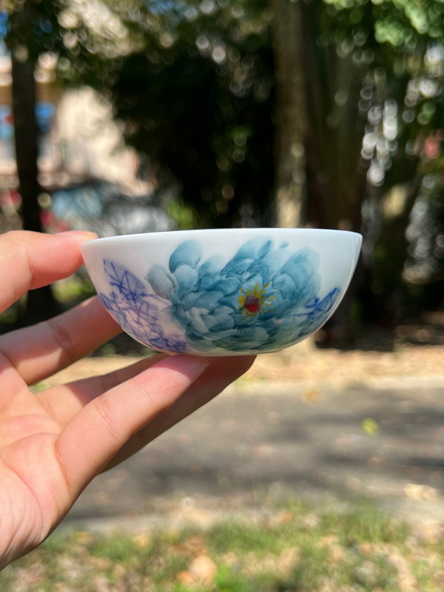 This is a Chinese Jingdezhen blue and white porcelain peony flower teacup