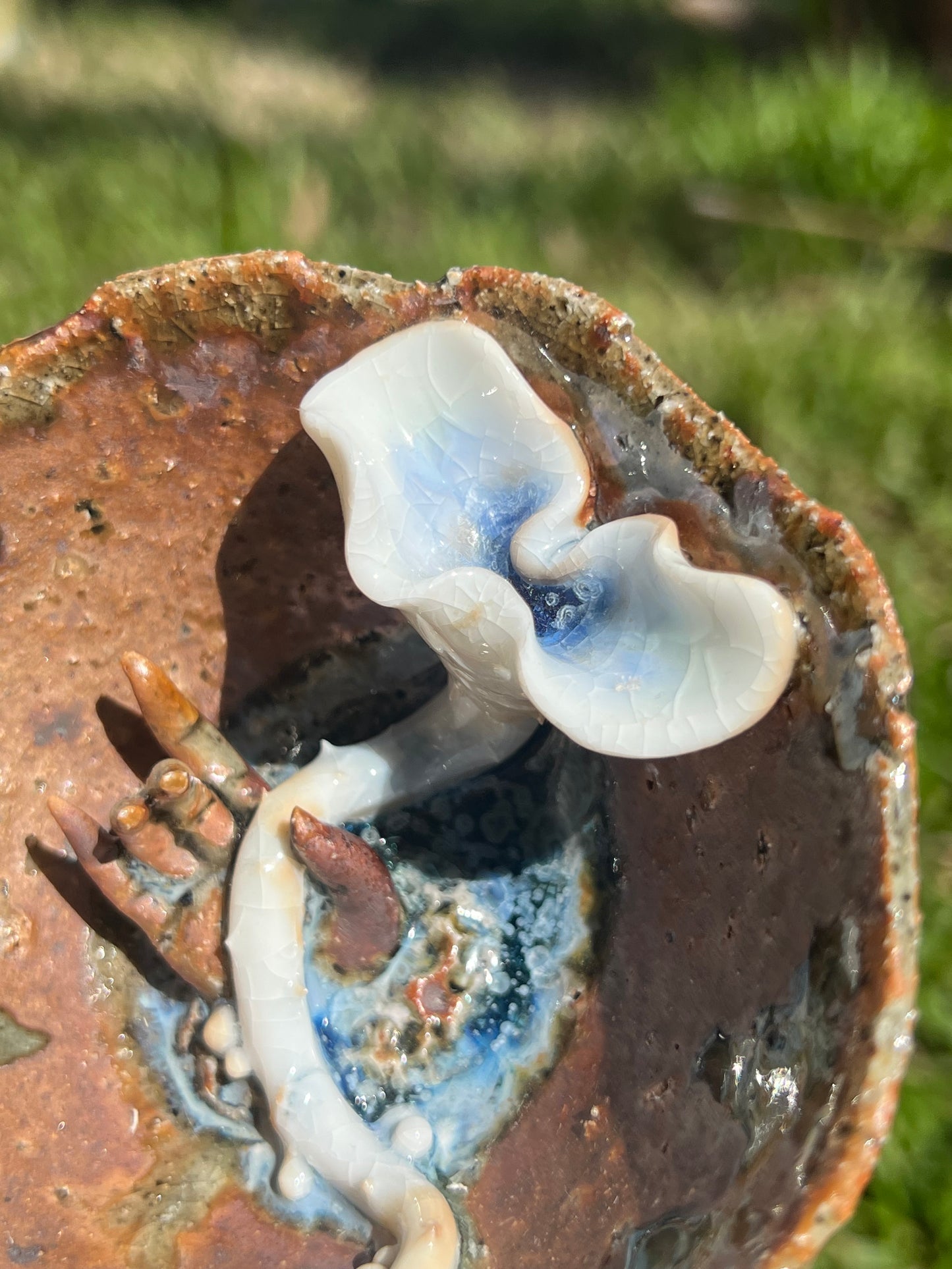 This is a woodfired pottery flower teacup