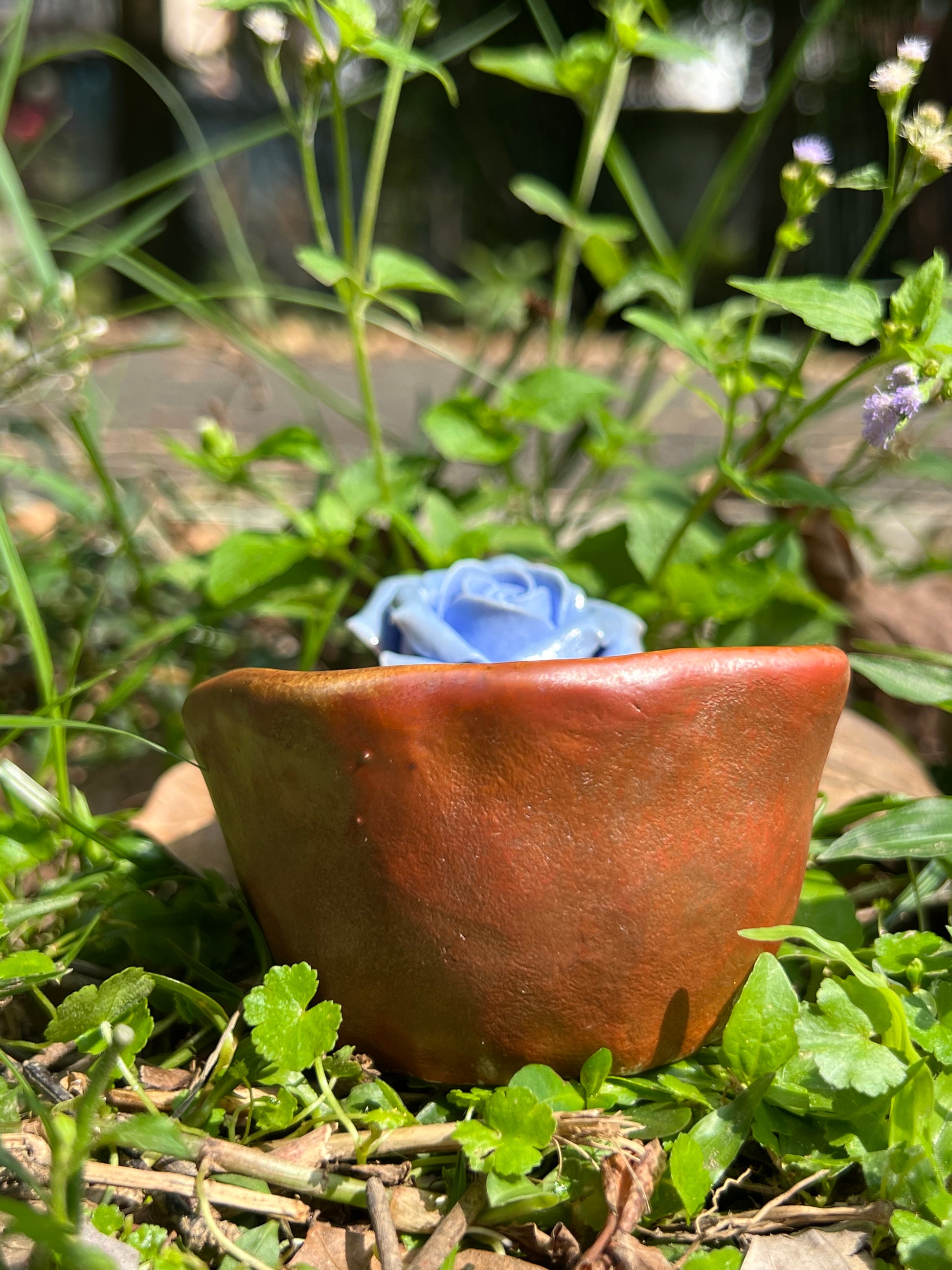 This is a woodfired pottery flower teacup