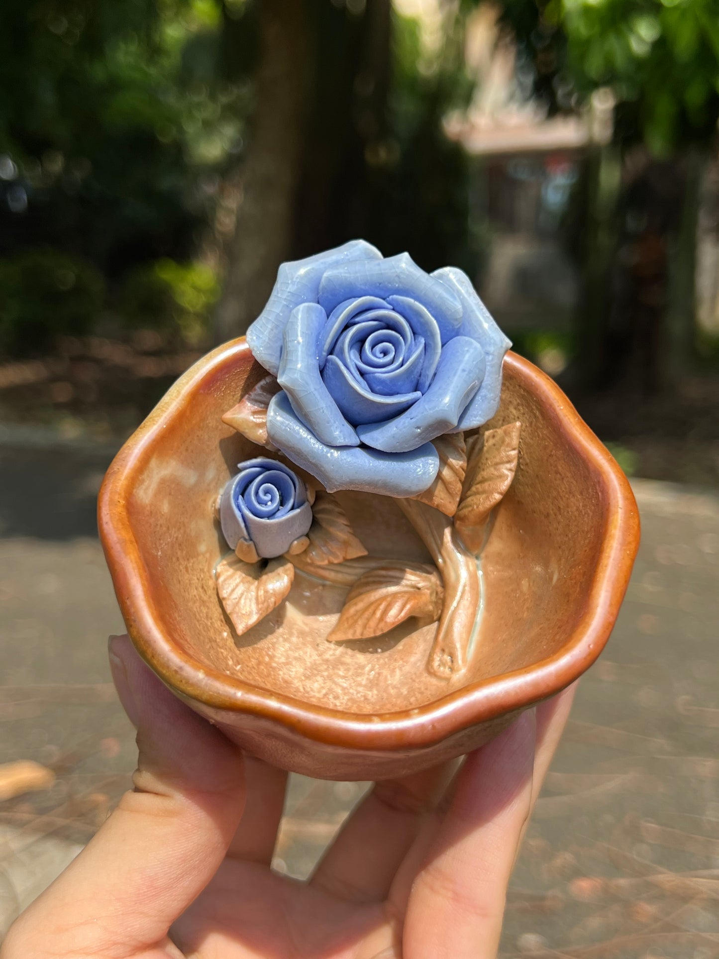 This is a woodfired pottery flower teacup