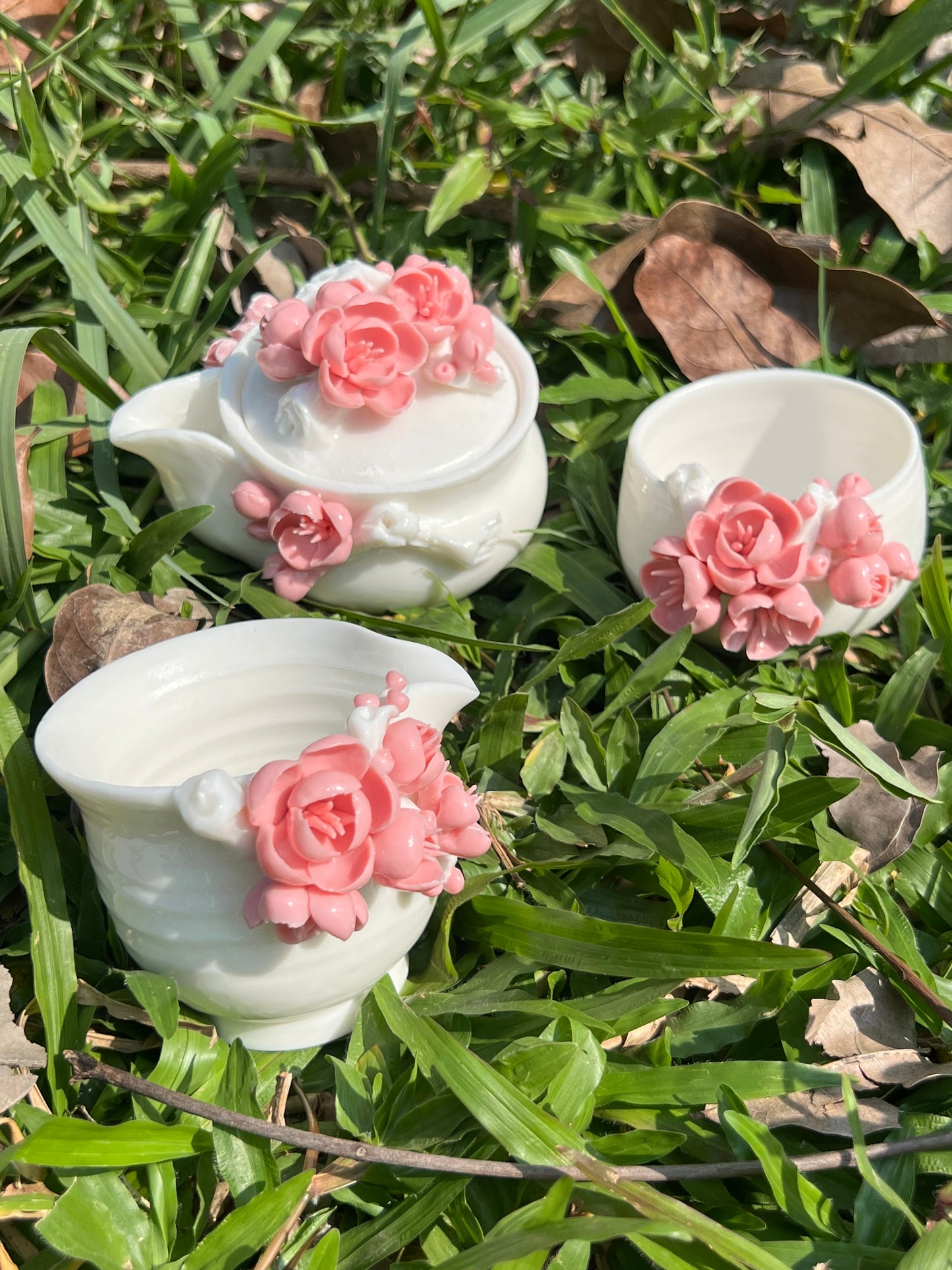 this is a woodfired white fine pottery flower teacup