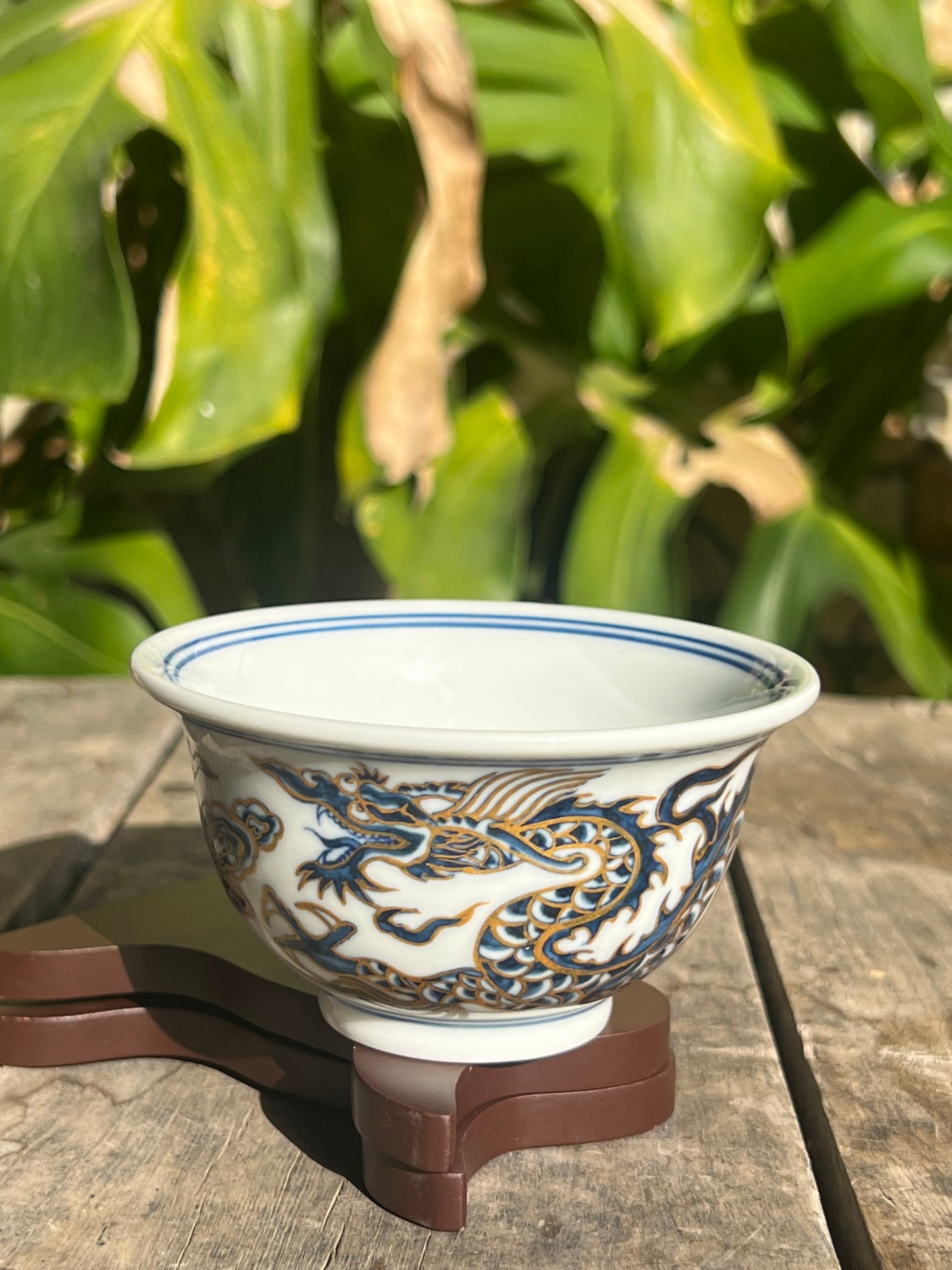 This is a Chinese Jingdezhen blue and white porcelain dragon tea cup