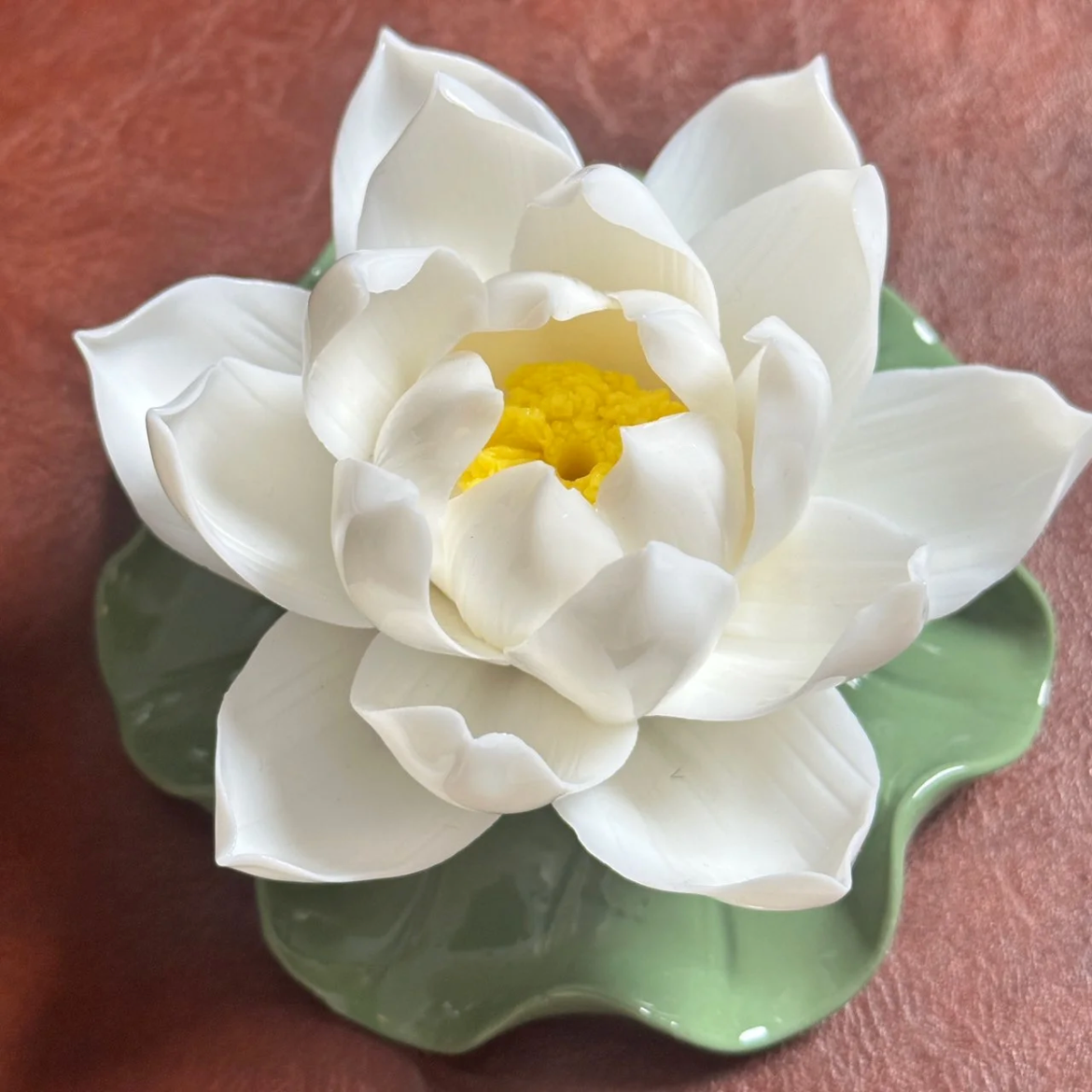 This is a ceramic lotus incense holder