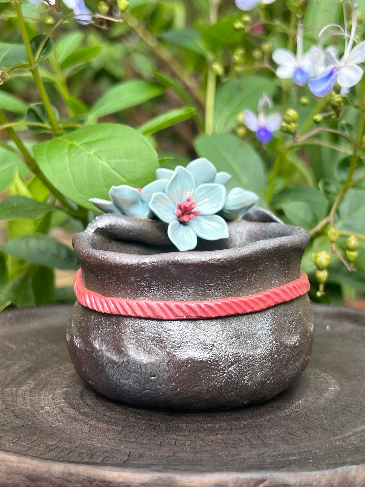 This is a woodfired tietai pottery flower teacup