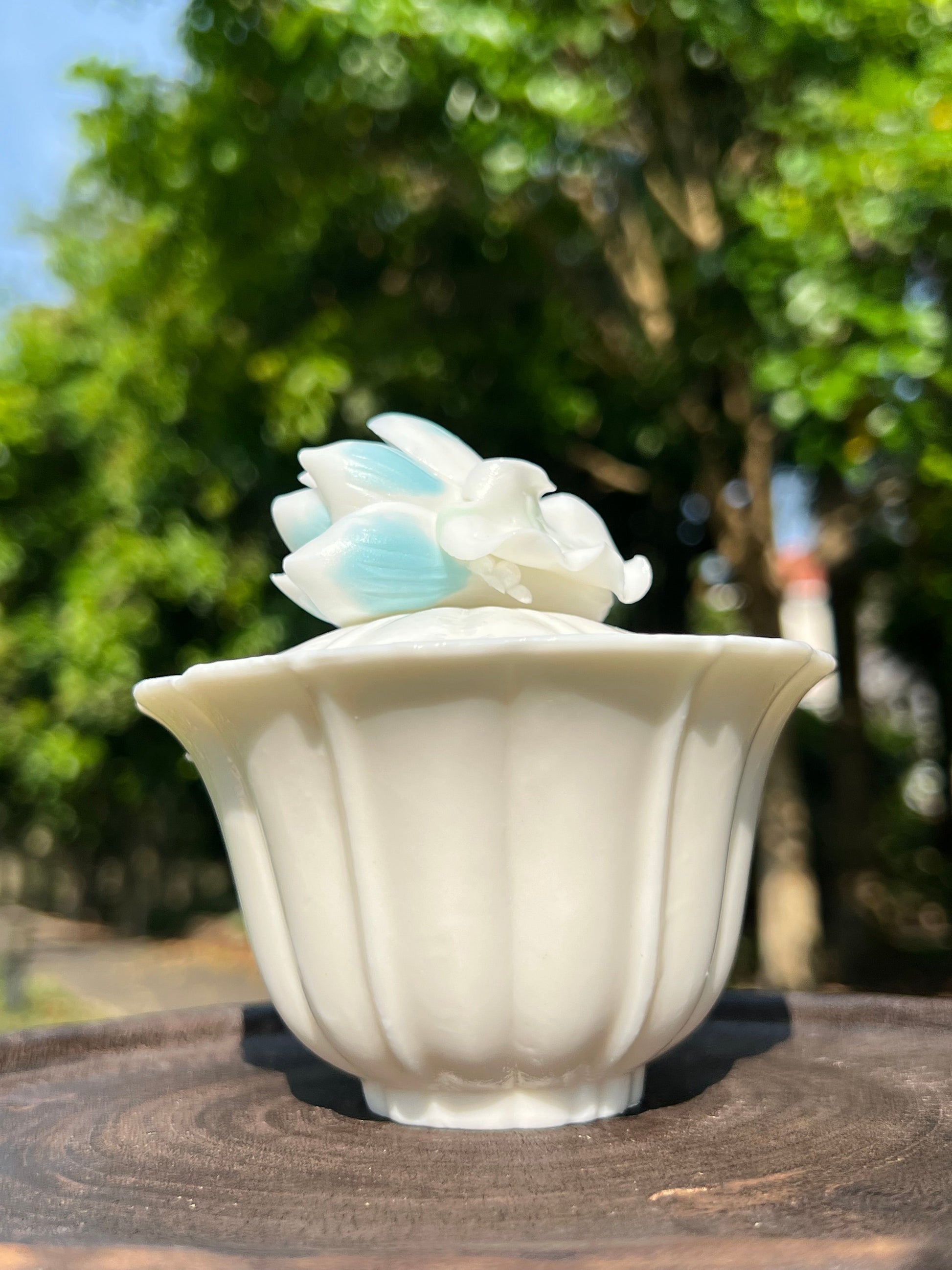 this is a woodfired white fine pottery flower teacup