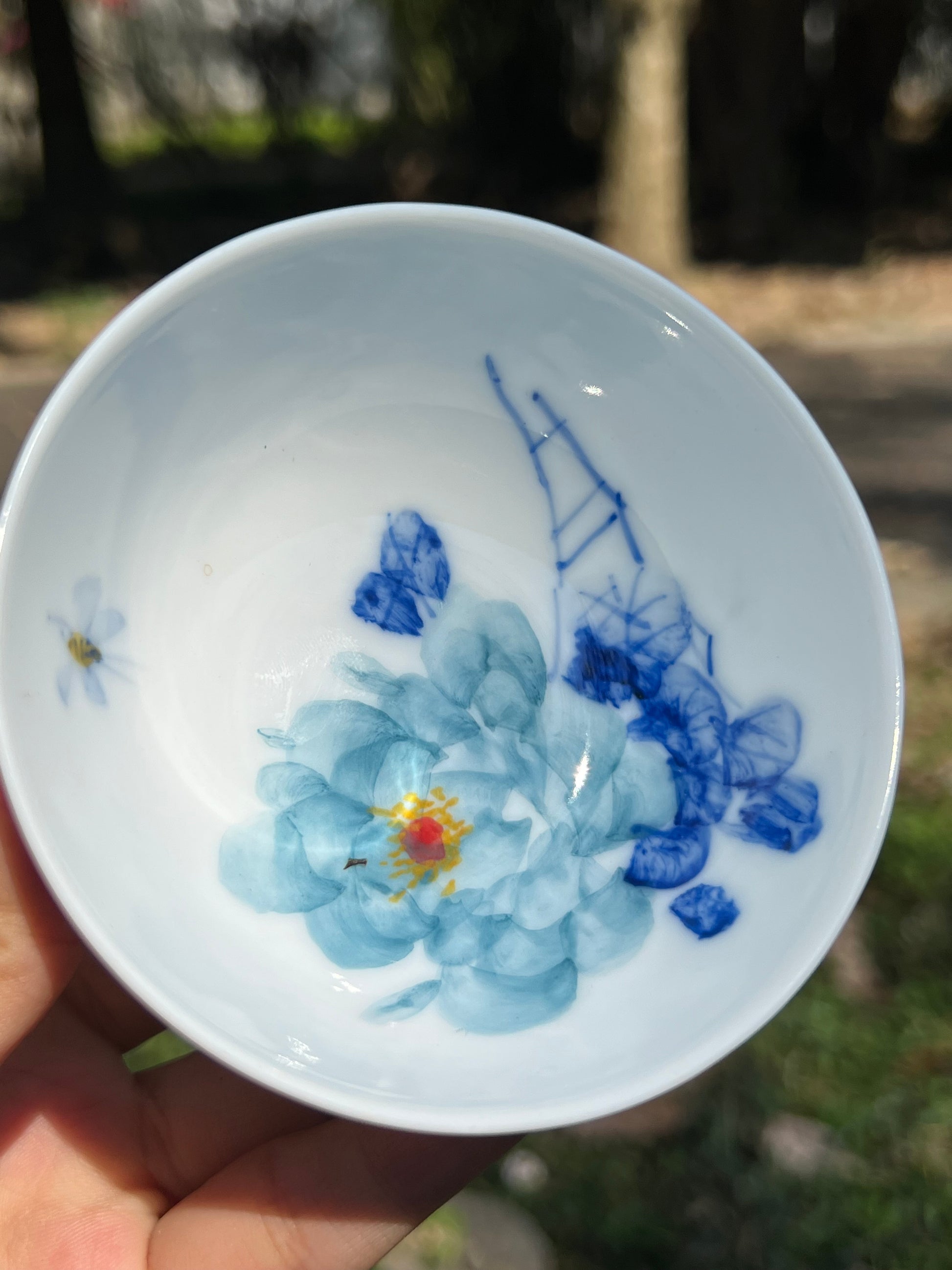 This is a Chinese Jingdezhen blue and white porcelain peony flower teacup