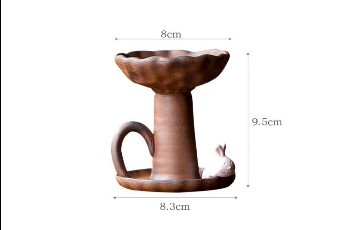 This is a pottery candlestick candle holder