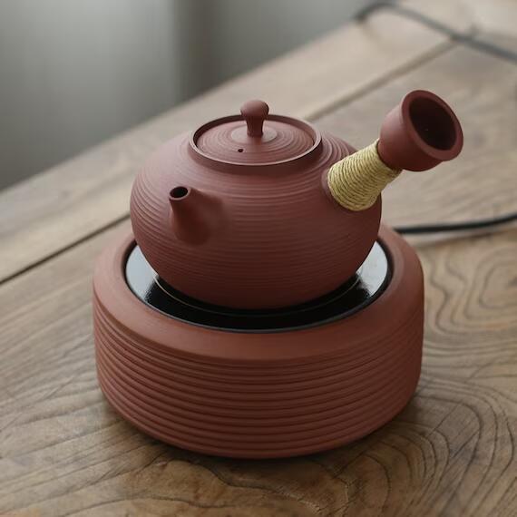 This is a pottery side handle kettle