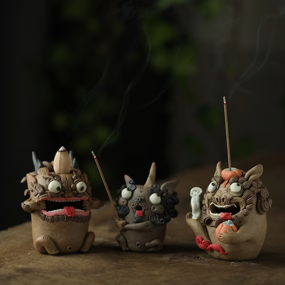 This is a pottery incense holder tea pet