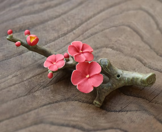 This is a ceramic flower incense holder