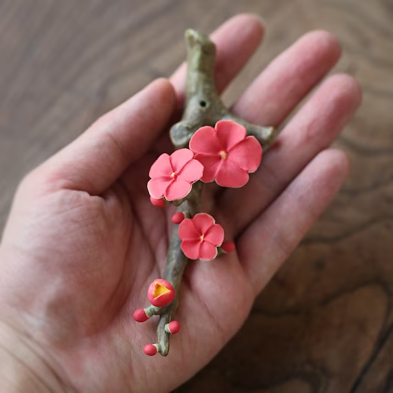 This is a ceramic flower incense holder