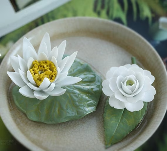 This is a ceramic flower incense holder