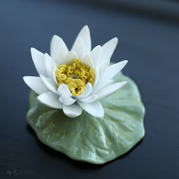 This is a ceramic flower incense holder