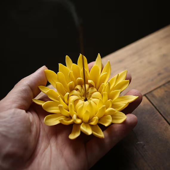 This is a ceramic flower incense holder