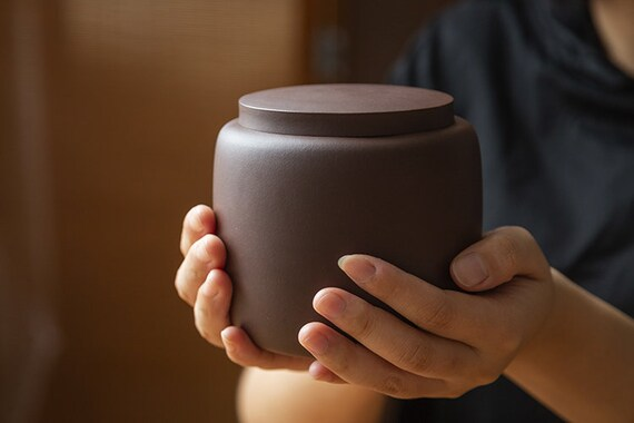 This is a zisha purple clay tea jar.this is a pottery tea storage canister