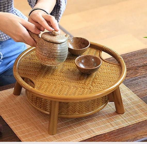 This is a bamboo weaving storage tea table.this is a yellow tea table