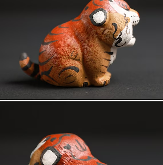 This is a Yixing purple clay tiger teapet