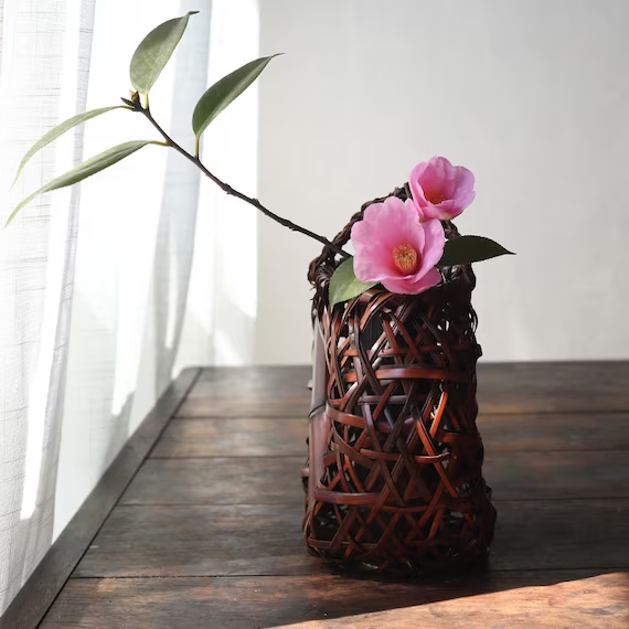 This is a bamboo weaving vase flower arrangement utensil