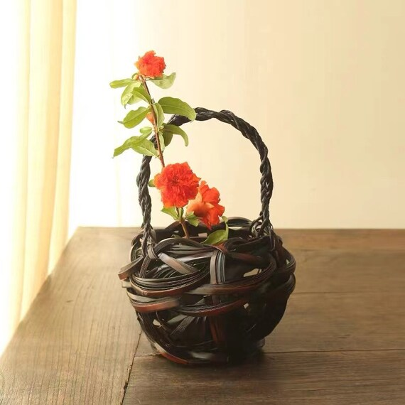 This is a bamboo weaving vase flower utensil