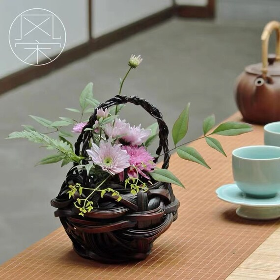 This is a bamboo weaving vase flower utensil