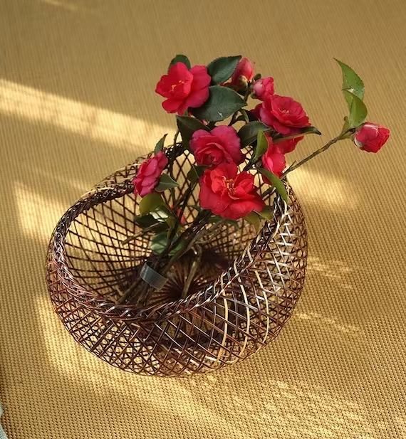 This is a bamboo weaving vase flower arrangement utensil