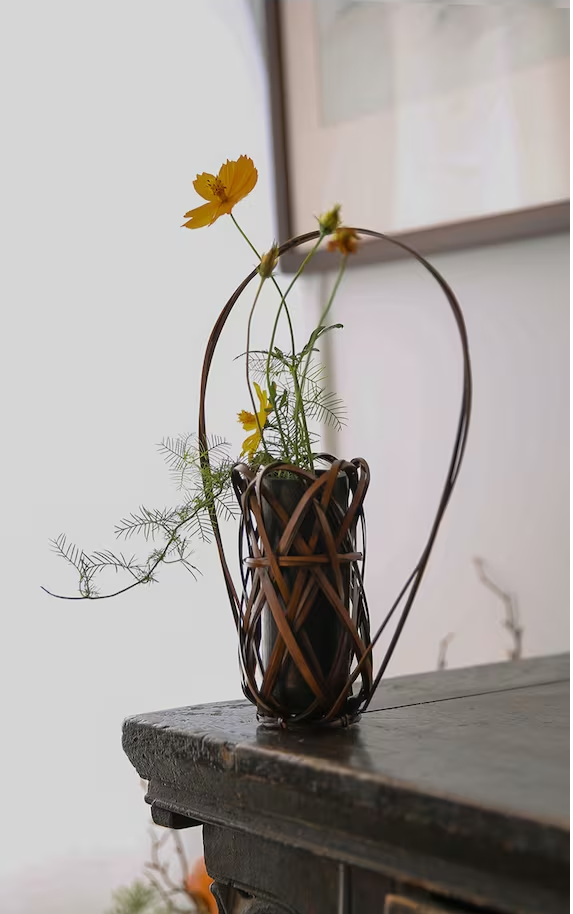 This is a bamboo weaving vase flower utensil