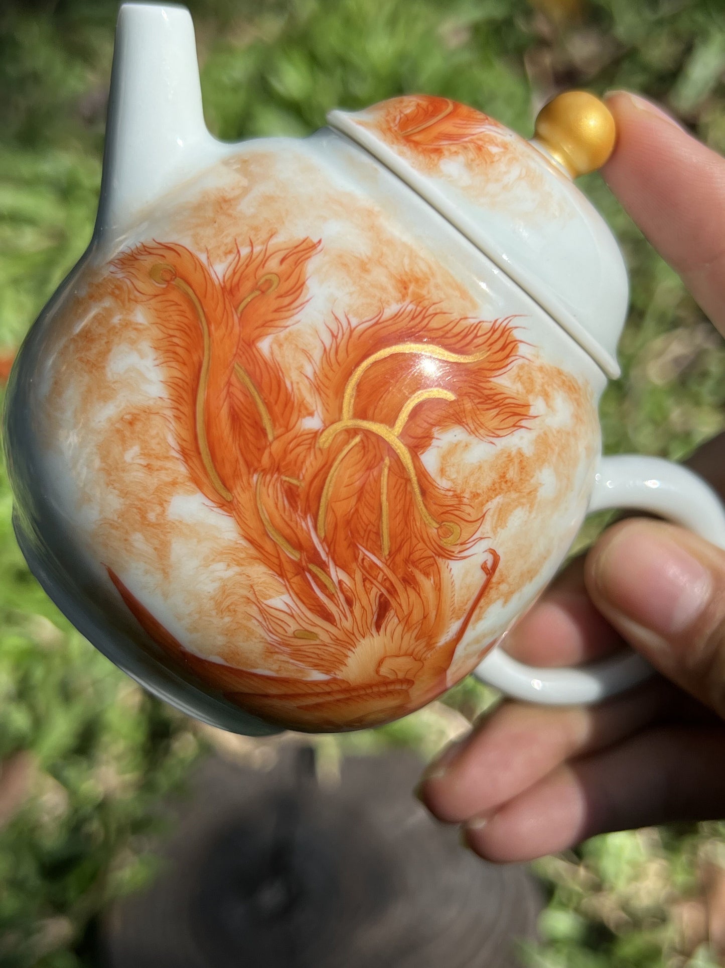 this is a Chinese Jingdezhen alum red phoenix teapot.this is a ceramic teapot