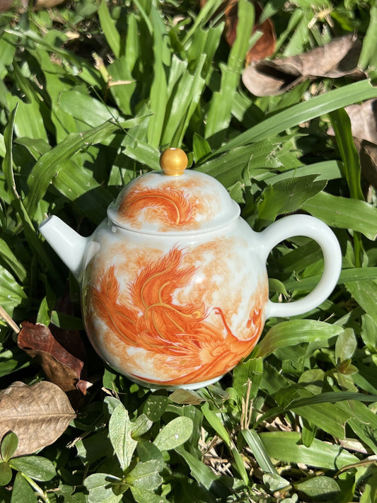 this is a Chinese Jingdezhen alum red phoenix teapot.this is a ceramic teapot