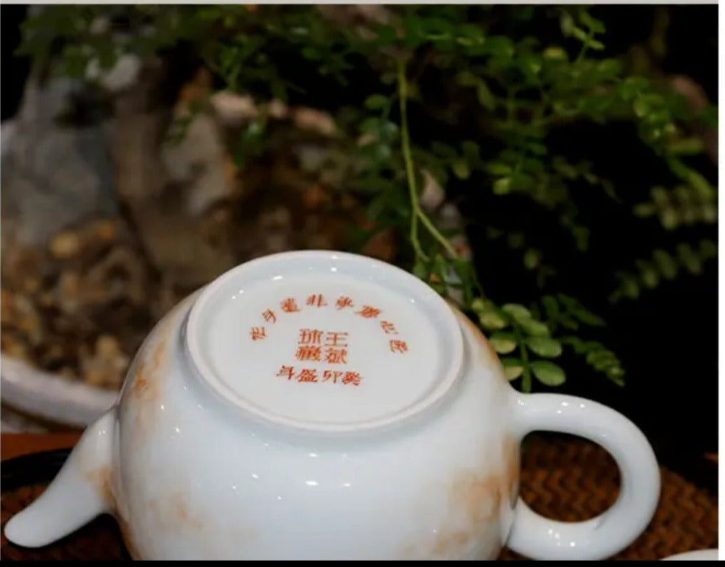 this is a Chinese Jingdezhen alum red dragon phoenix teapot.this is a ceramic teapot