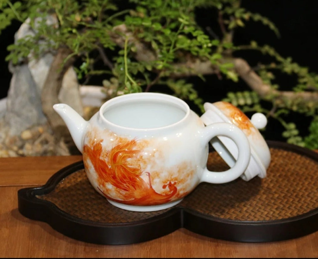 this is a Chinese Jingdezhen alum red dragon phoenix teapot.this is a ceramic teapot