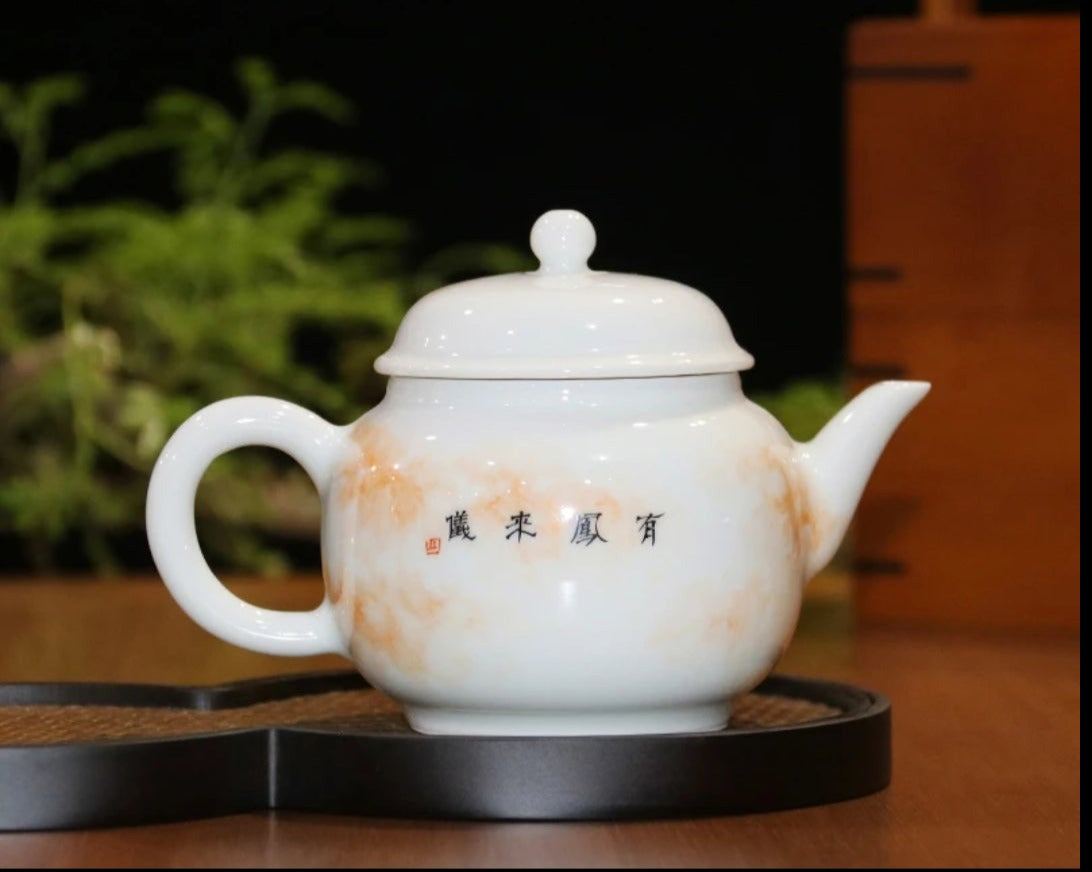 this is a Chinese Jingdezhen alum red dragon phoenix teapot.this is a ceramic teapot