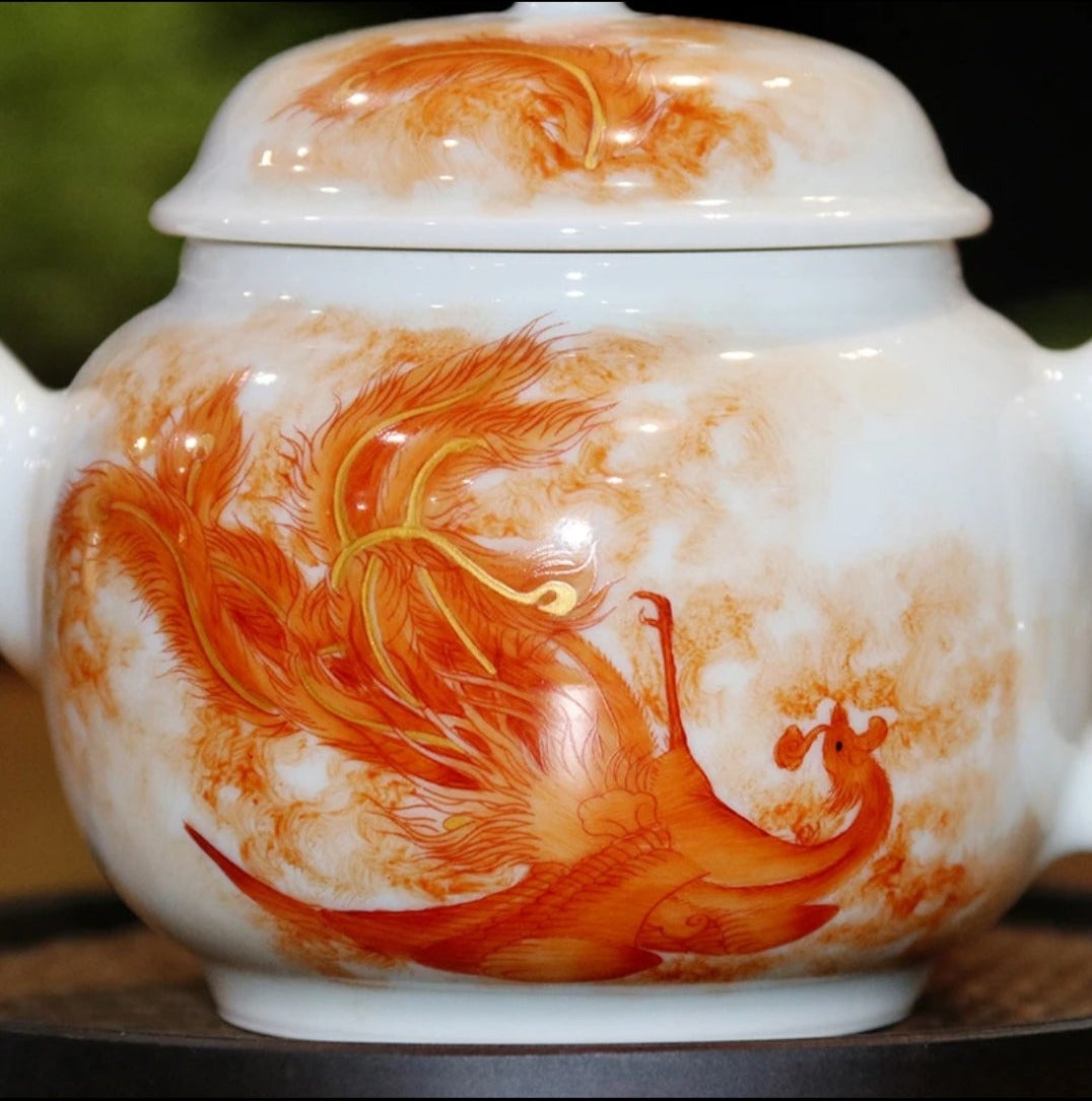 this is a Chinese Jingdezhen alum red dragon phoenix teapot.this is a ceramic teapot