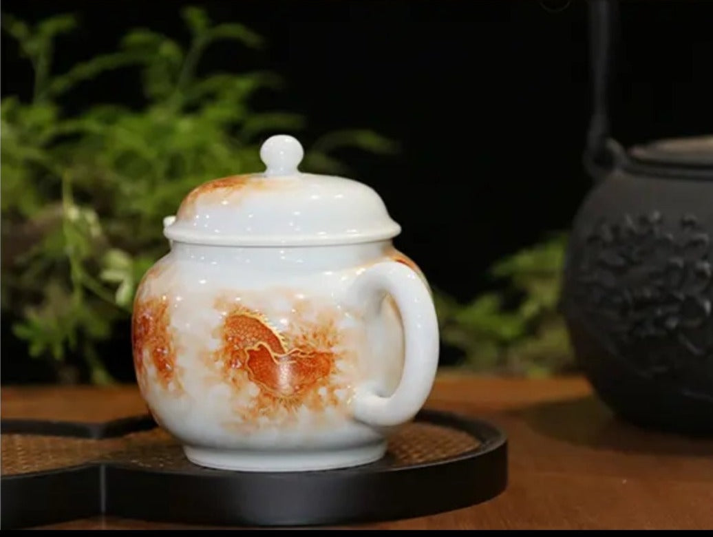 this is a Chinese Jingdezhen alum red dragon phoenix teapot.this is a ceramic teapot