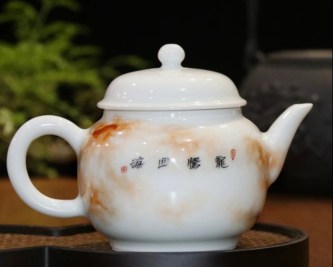 this is a Chinese Jingdezhen alum red dragon phoenix teapot.this is a ceramic teapot