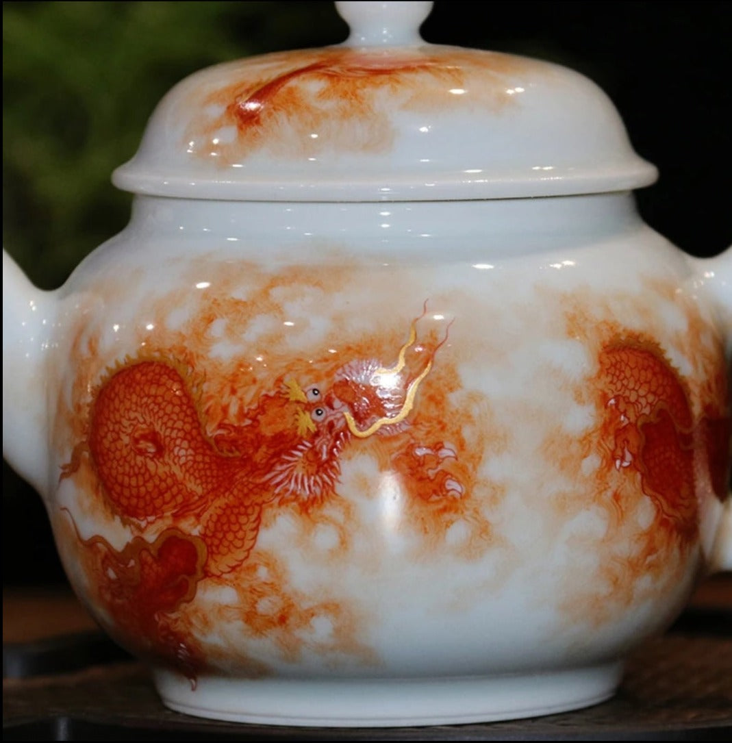 this is a Chinese Jingdezhen alum red dragon phoenix teapot.this is a ceramic teapot