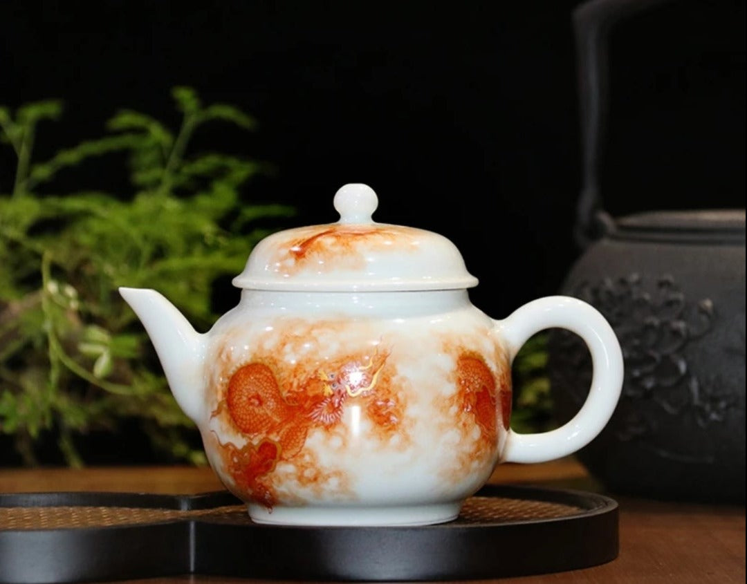 this is a Chinese Jingdezhen alum red dragon phoenix teapot.this is a ceramic teapot