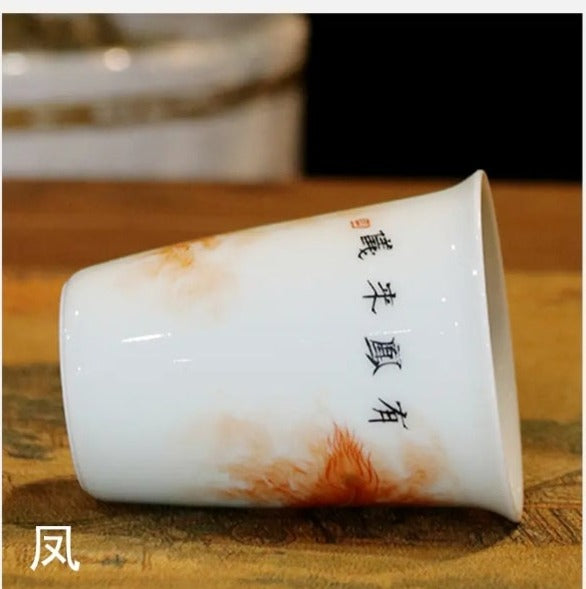 this is a Chinese Jingdezhen alum red dragon phoenix teacup.this is a ceramic teacup