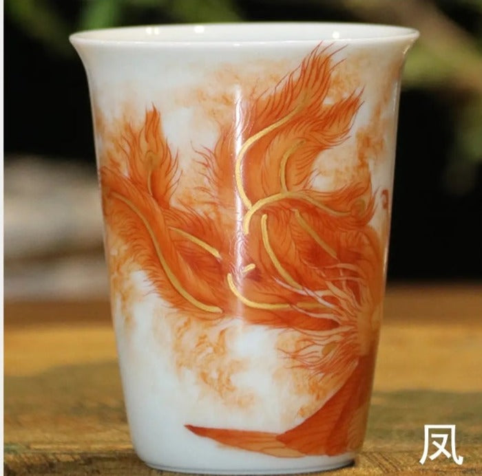 this is a Chinese Jingdezhen alum red dragon phoenix teacup.this is a ceramic teacup