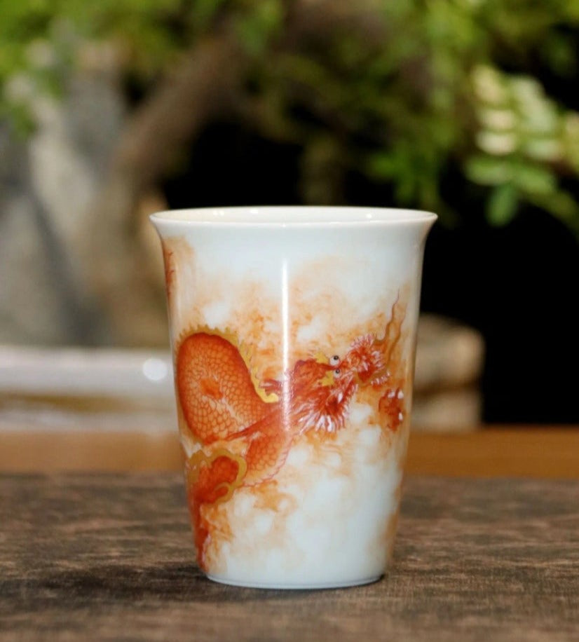 this is a Chinese Jingdezhen alum red dragon phoenix teacup.this is a ceramic teacup