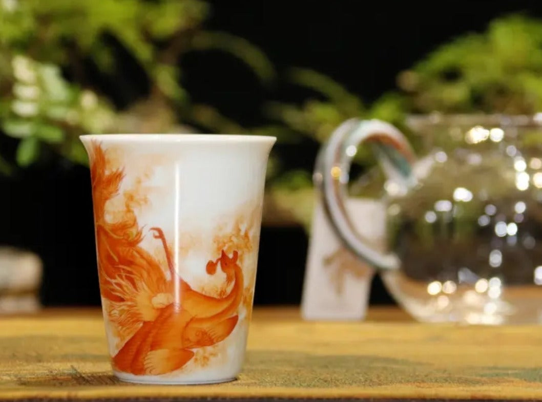 this is a Chinese Jingdezhen alum red dragon phoenix teacup.this is a ceramic teacup