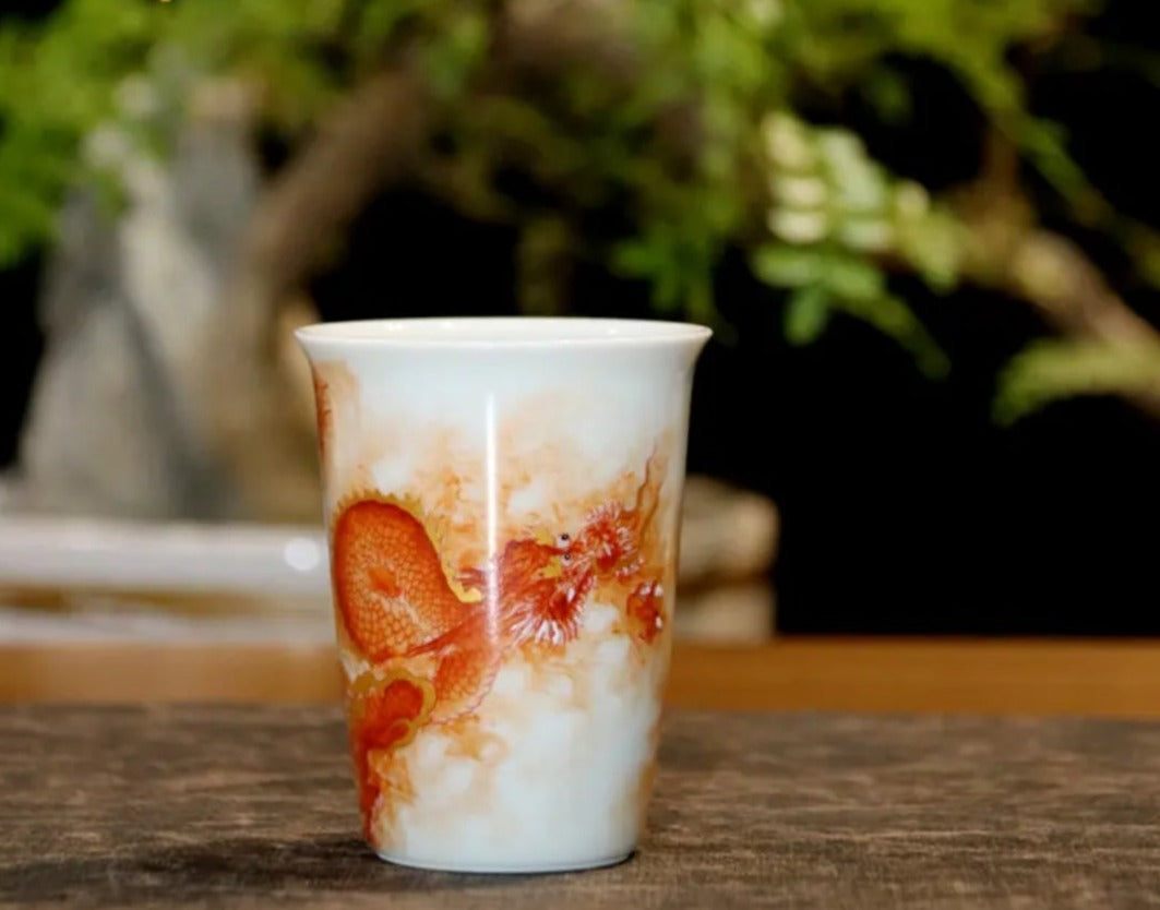 this is a Chinese Jingdezhen alum red dragon phoenix teacup.this is a ceramic teacup