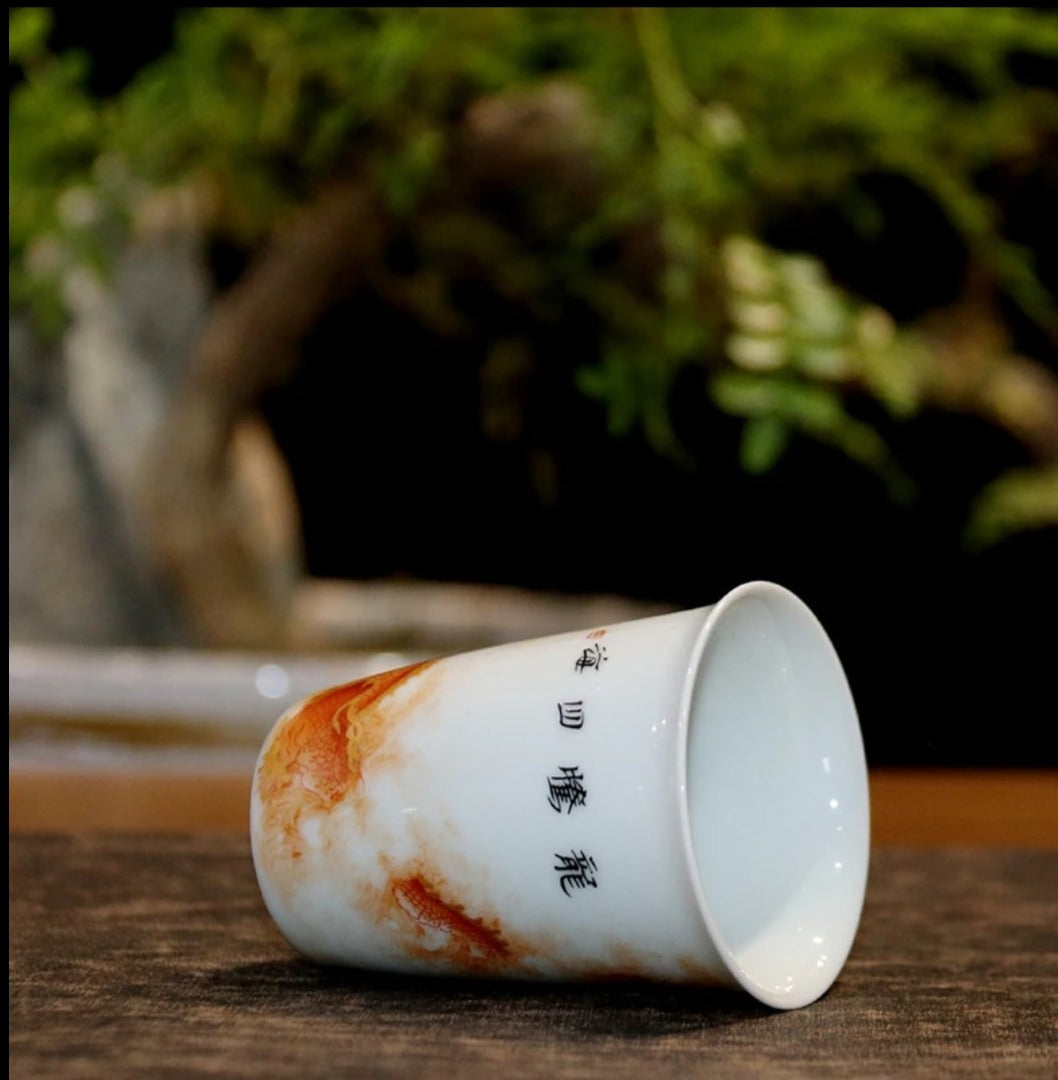 this is a Chinese Jingdezhen alum red dragon phoenix teacup.this is a ceramic teacup