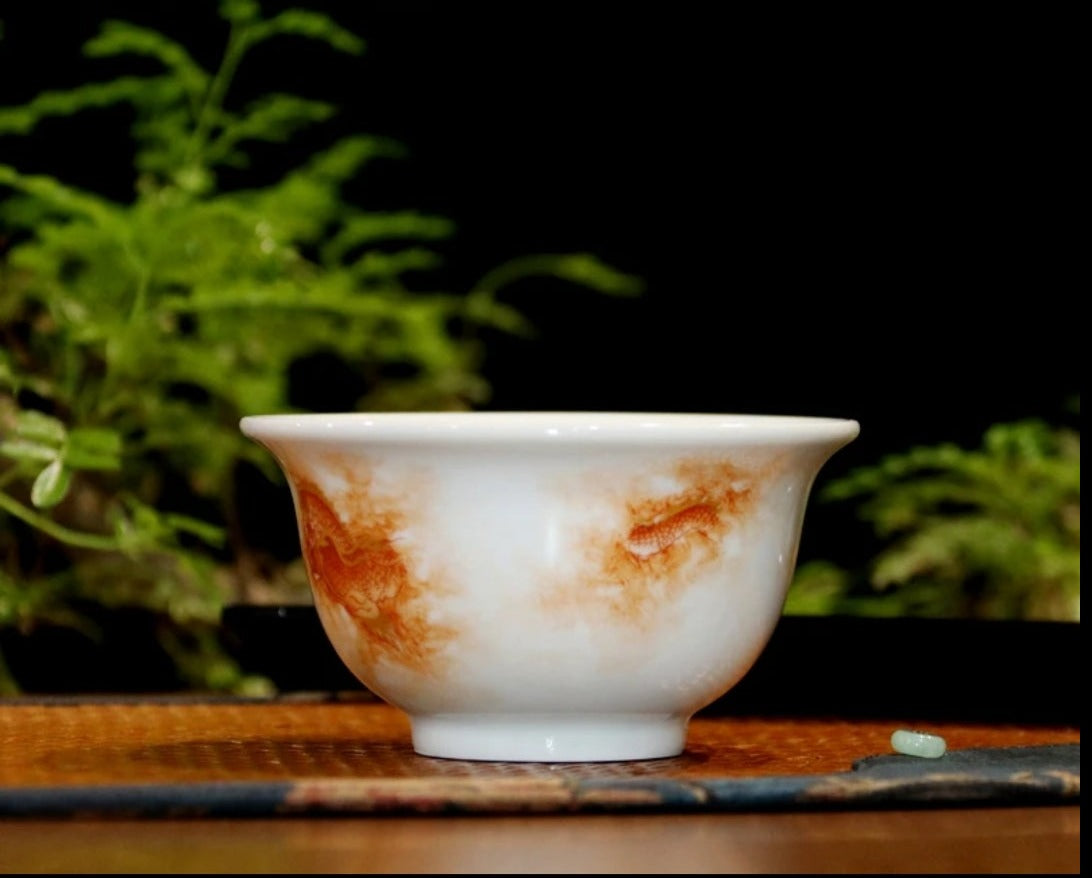 this is a Chinese Jingdezhen alum red dragon phoenix teacup.this is a ceramic teacup