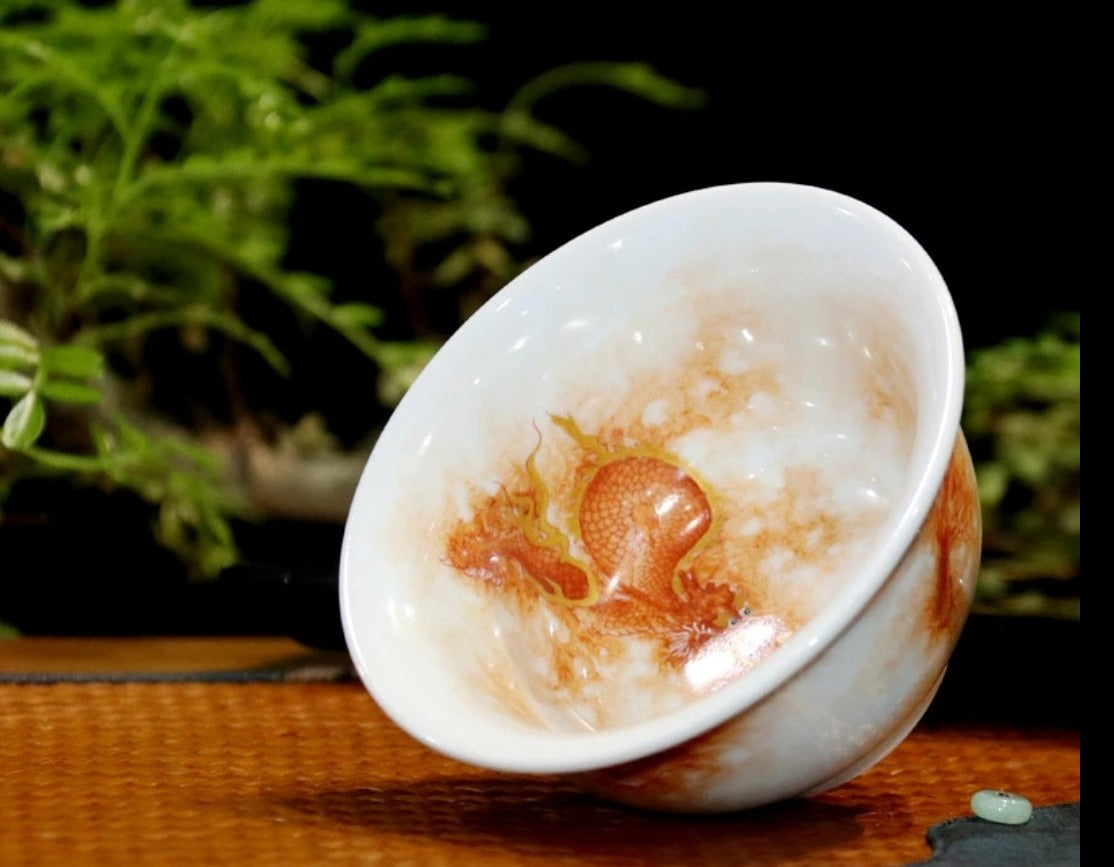 this is a Chinese Jingdezhen alum red dragon phoenix teacup.this is a ceramic teacup