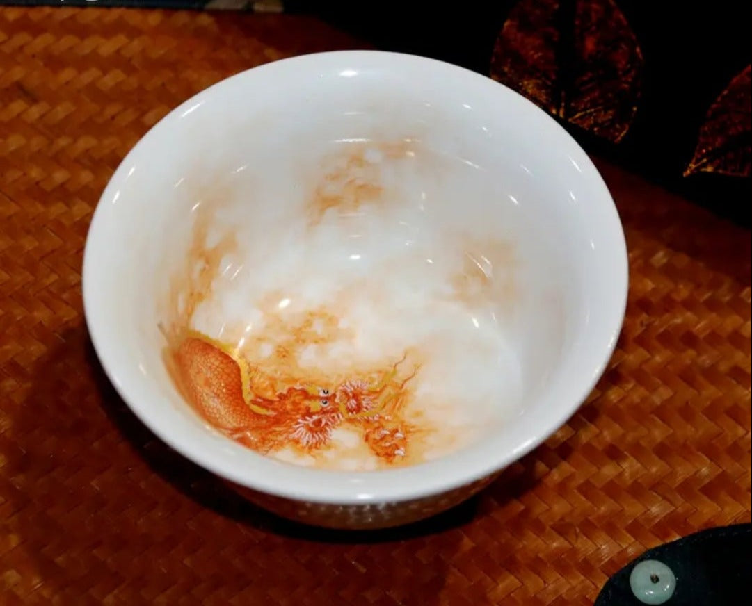 this is a Chinese Jingdezhen alum red dragon phoenix teacup.this is a ceramic teacup